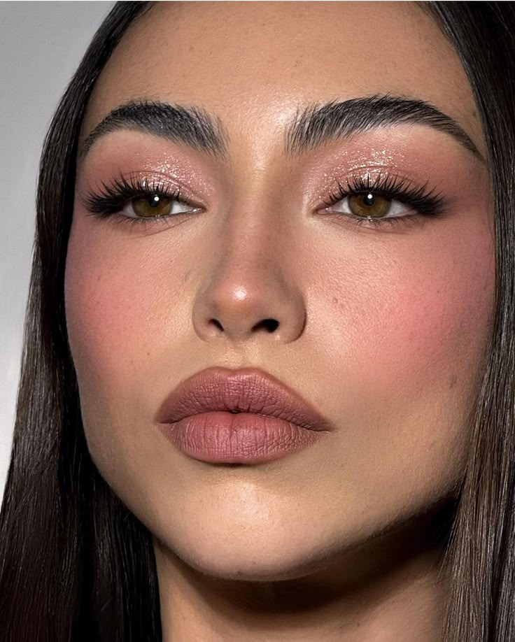 Rose gold shimmer spring eye look with warm blush and glossy skin
