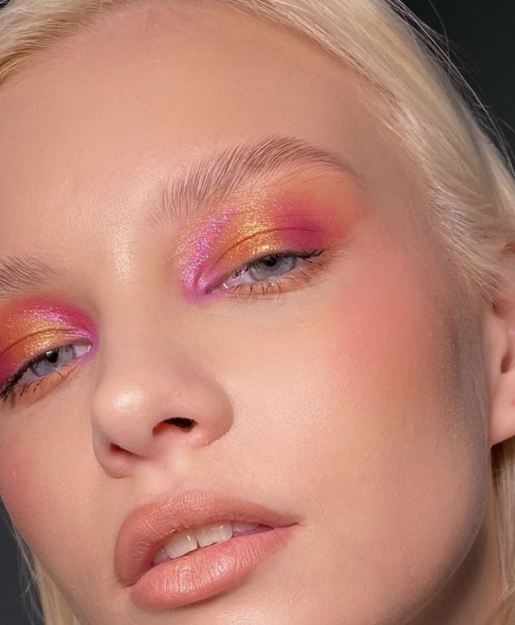 Layered pink and gold shimmer editorial spring eye look with minimal skin